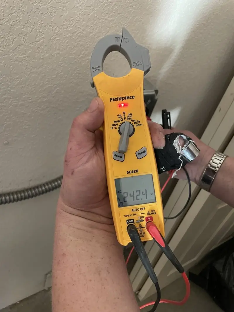 Voltage testing with clamp meter during Circuit Breaker Repair in Lindstrom